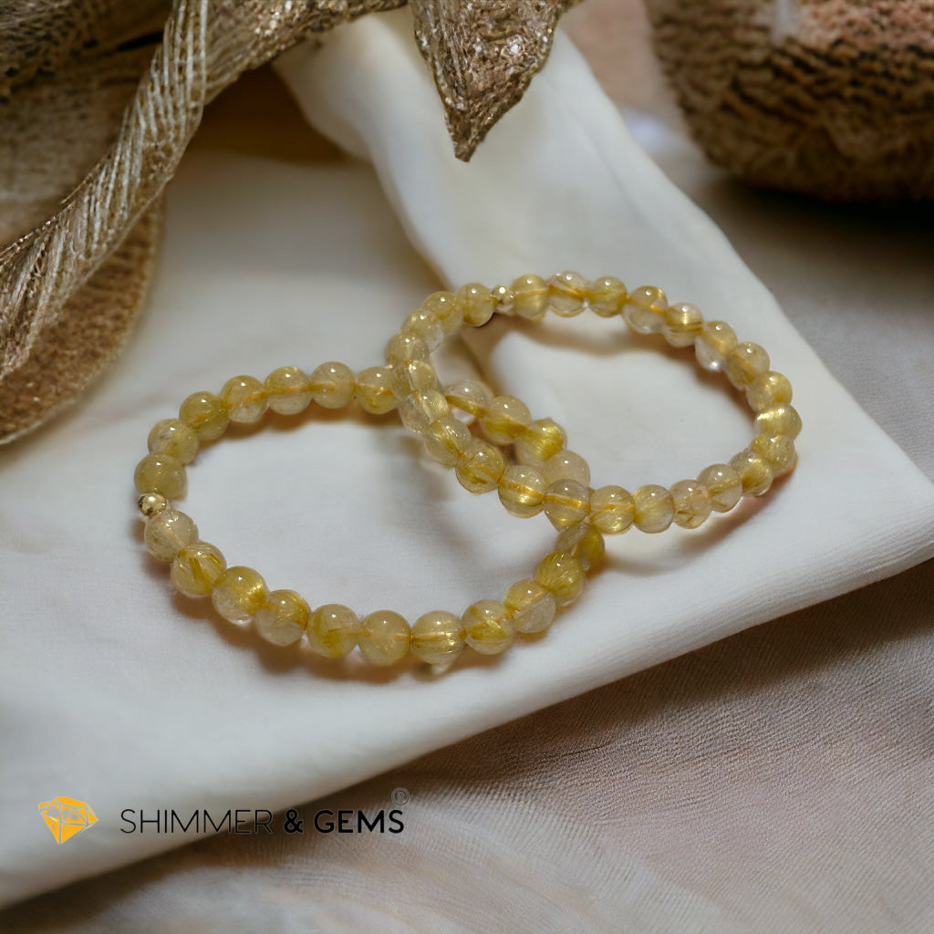 Golden Rutilated 7mm AAAA Grade Bracelet with 14k gold filled Bead