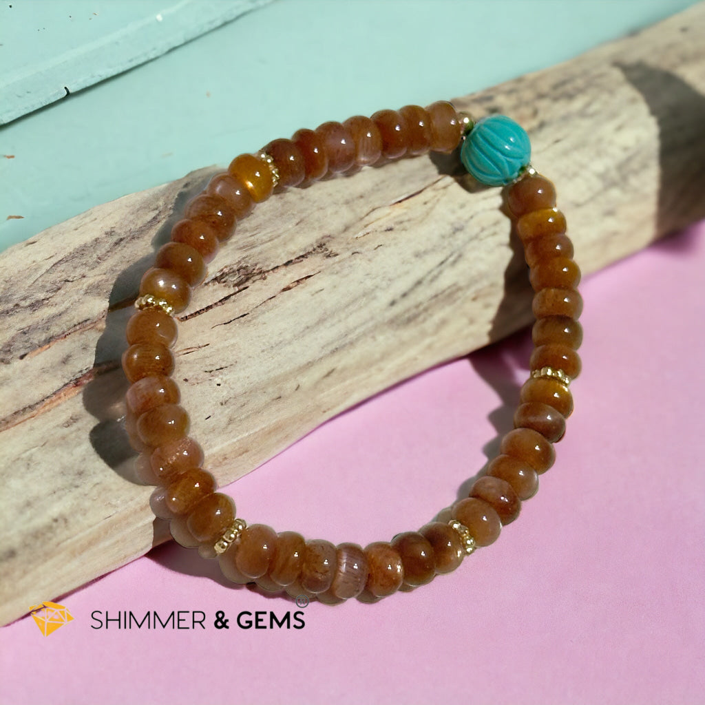 Golden Sunstone Rondelle with Lotus Turquoise Bracelet